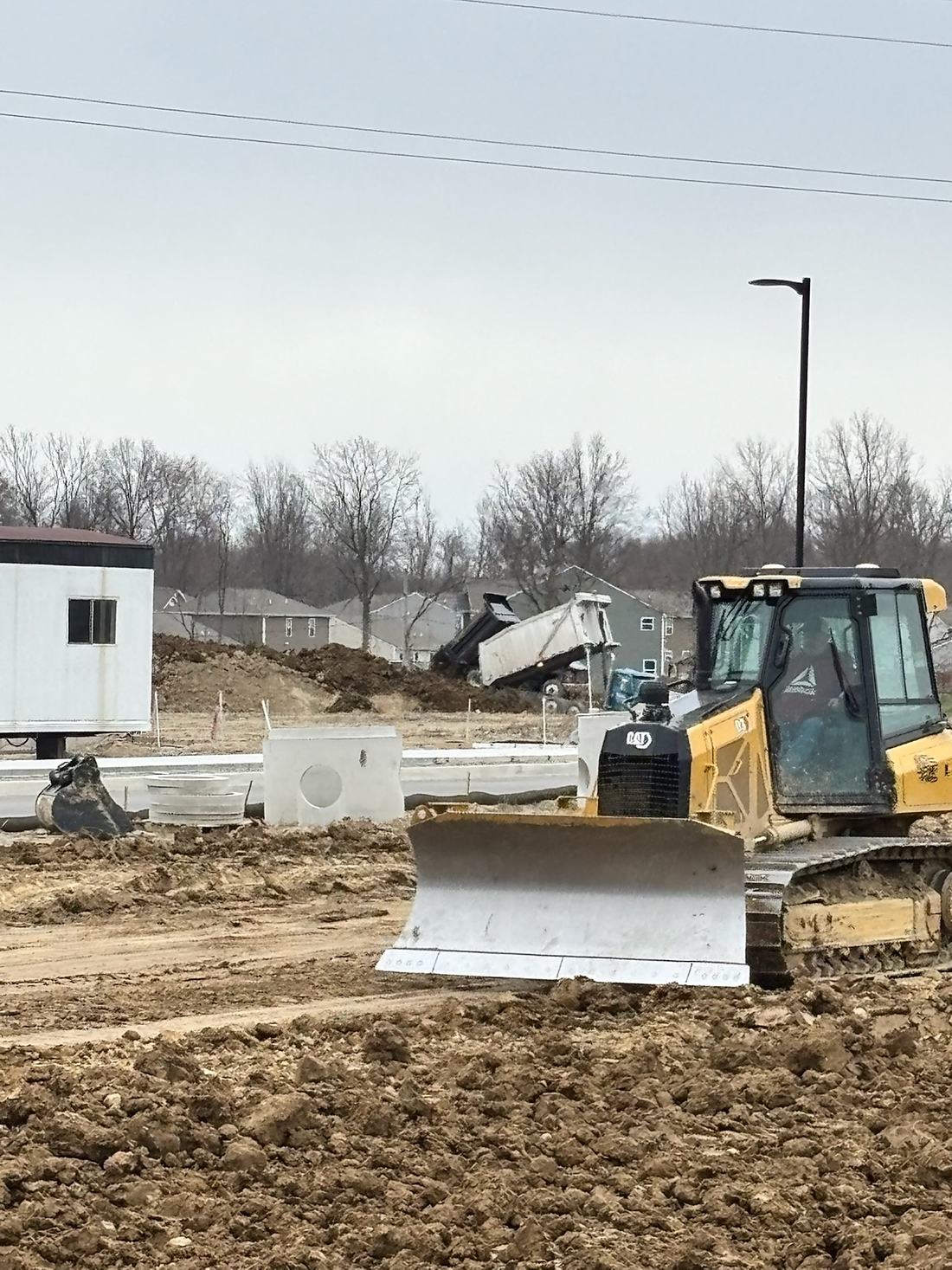 BDX dozer pushing grade across a commercial site in Northeast Indiana
