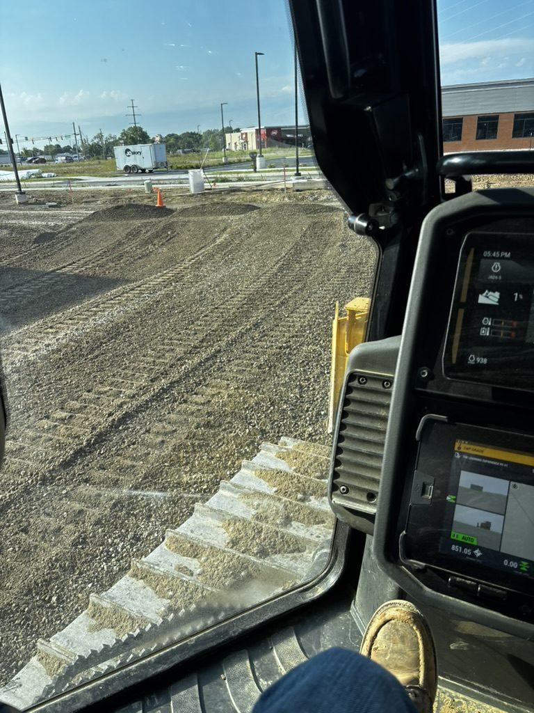 Machine-control grade display in a BDX machine over freshly graded stone
