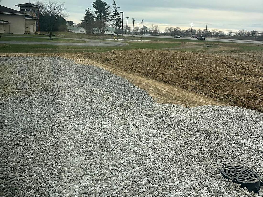 Compacted stone drive and drainage structure on a Northeast Indiana property