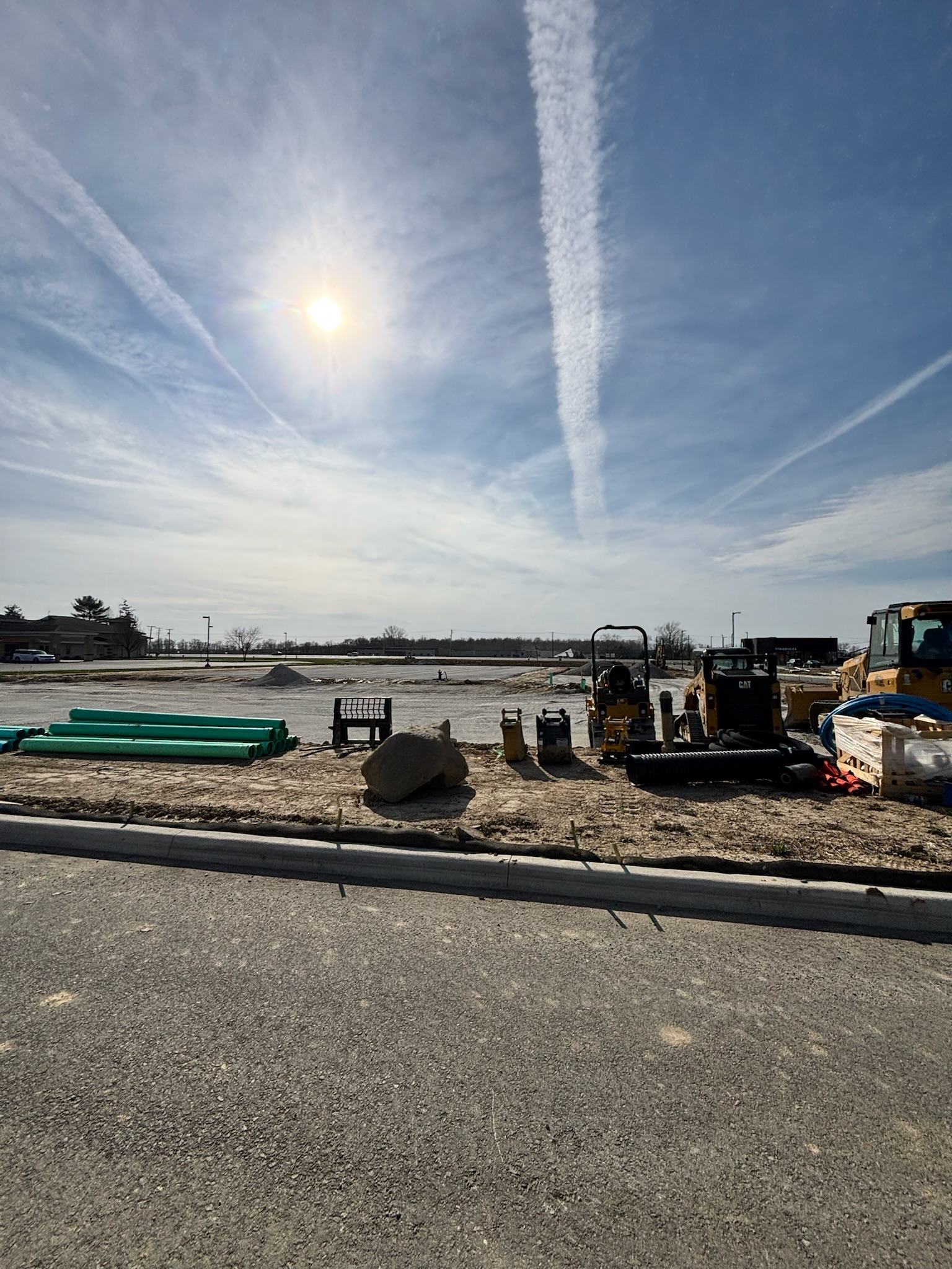 Pipe and structures staged on a BD Excavation commercial site