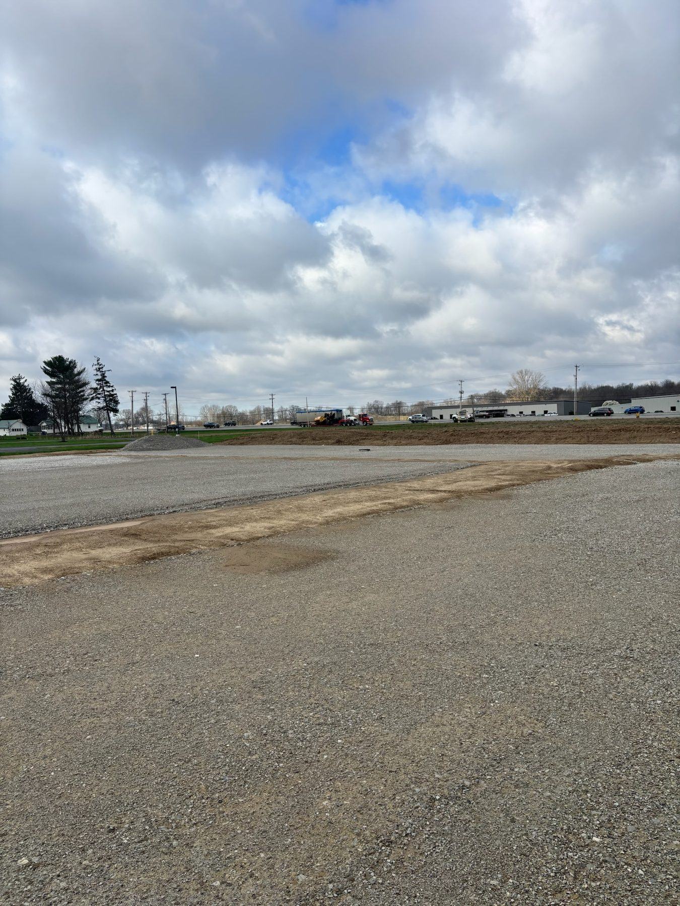 Prepared aggregate base extending across a commercial building site
