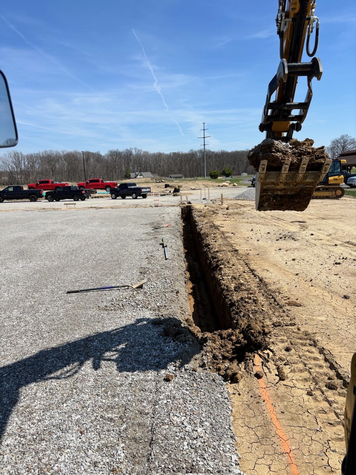 BDX storm sewer trench cut across an existing drive on a commercial site